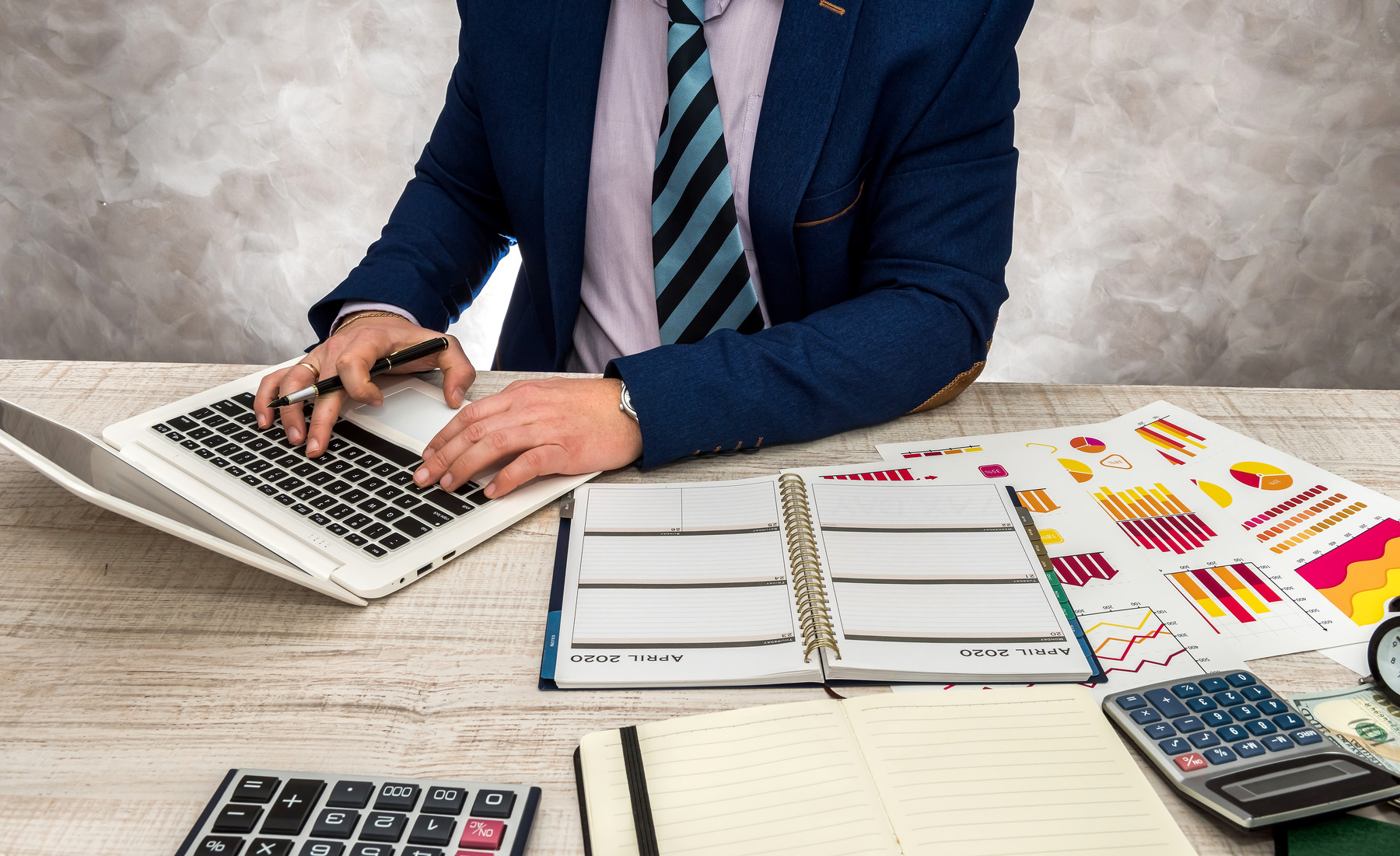 businessman-working-office-with-business-graphs-laptop-notepad (1)